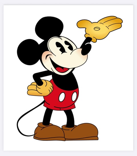Classic Mickey Mouse character with black ears and body, red shorts, yellow gloves, and brown shoes, waving his hand cheerfully